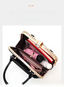 Top view of spacious black patent leather handbag showing interior storage for essentials