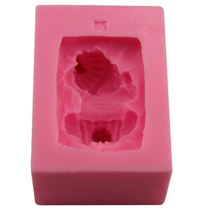 Pink silicone mold for baby sleeping soap or cupcake crafts, top view on white background