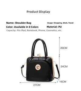 Detail view of black patent PU leather tote with golden cat logo and spacious interior