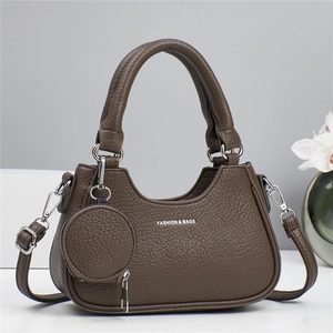 Dark brown pebble leather handbag with round coin purse and silver metal accents