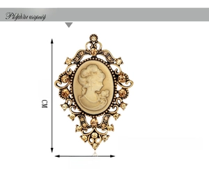 Retro cameo brooch with amber crystals and size measurements in 6.5 cm by 4.3 cm