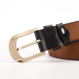 Close-up of golden pin buckle with premium brown cowhide leather belt and black loop