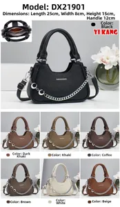 Detail of minimalist leather crossbody bag with silver chain and adjustable strap