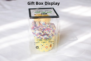 Creative cupcake-shaped coral fleece socks presented in a transparent PVC gift box