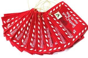 Set of red felt Santa envelope ornaments with festive airmail details and gold hanging strings