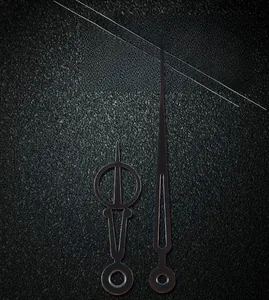Close-up of matte black metal wall clock needles model 504 with hollow ring detail