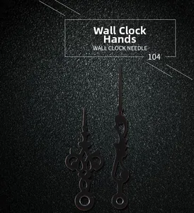 Detailed view of ornate hollow black wall clock hands in vintage European style