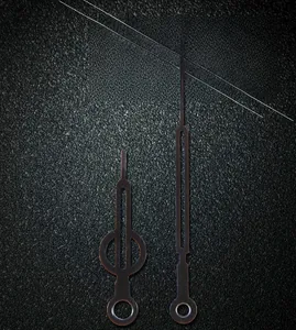 Detail of 905 model black metal gear wall clock hands with hollowed design