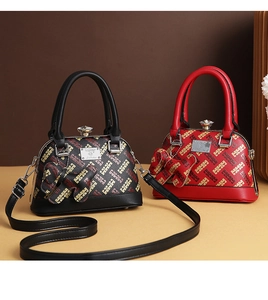 Detail view of red and black shell handbags with H-pattern jacquard and diamond clasp