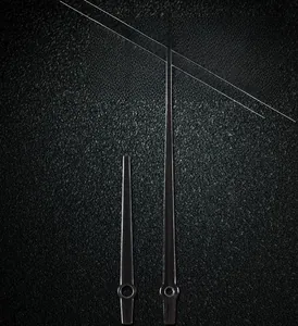 Detail of model 105 black metal wall clock needles with a sleek polished finish