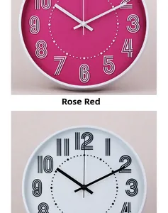 Detail of rose red and white silent wall clocks with 3D numeric scales and modern design