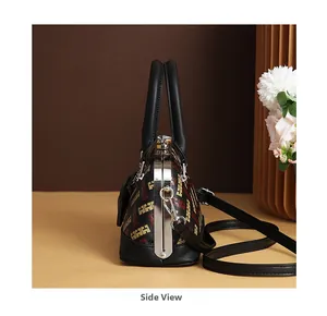 Side view of vintage doctor-style handbag with geometric print and metal frame