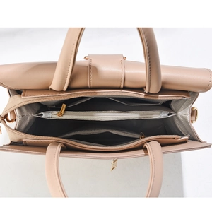Top view of large handbag showing three inner compartments and beige textured leather