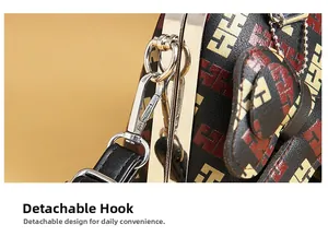 Macro shot of the detachable metallic hook and H-pattern leather texture on large handbag