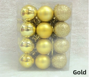 Detail of 12 gold Christmas ball ornaments with mirror matte and glitter finishes in a box