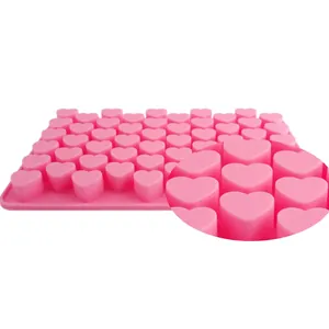 Pink silicone mold with 55 small heart cavities for chocolate and baking decorations