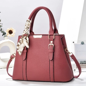 Deep burgundy lychee texture handbag with gold hardware and stylish patterned silk scarf