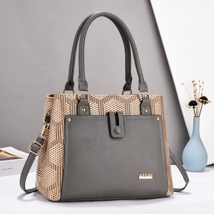 Fashionable grey and gold woven tote bag with adjustable shoulder strap and round handle