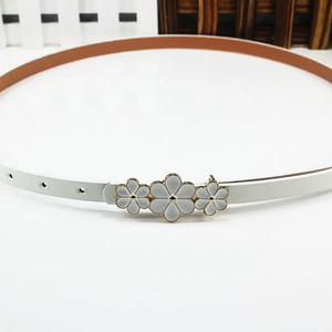 White flower buckle thin leather belt with gold trim and dual-tone strap for women