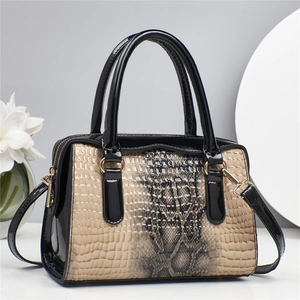 Elegant stone pattern patchwork handbag with gold hardware and adjustable crossbody strap