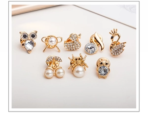 Collection of gold-toned alloy animal brooches featuring inlaid rhinestones and pearls