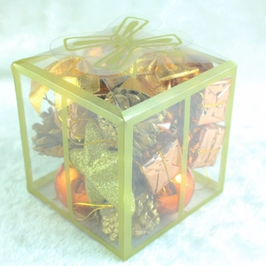 Christmas tree decoration set in bronze gold with stars and cones in a clear gift box