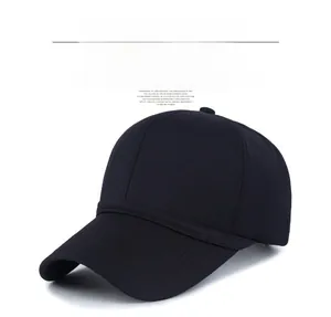 Detail view of a lightweight black baseball cap featuring a silver metal shield logo