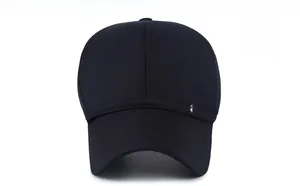 Detailed front view of black cotton baseball cap with a decorative metal shield badge