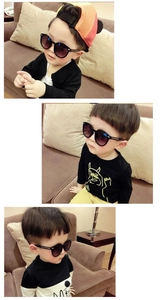 Detailed views of kids round sunglasses featuring metal arrow studs and UV400 lenses