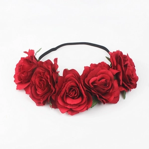 Detail of red rose headband with five realistic silk flowers on black elastic strap