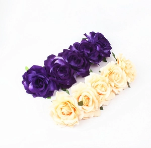 Detailed view of handmade silk rose flower heads in purple and champagne yellow colors