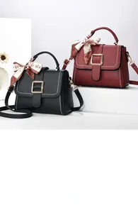 Detailed view of lychee leather textures with decorative silk scarf handles on elegant bags