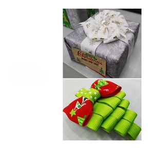 Detailed view of handmade Christmas tree hair clip crafted with festive ribbons
