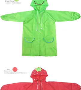 Detail of waterproof kids raincoats in green frog and red strawberry cartoon designs