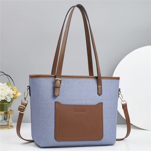 Fashion patchwork bucket bag in blue canvas and brown leather with shoulder strap