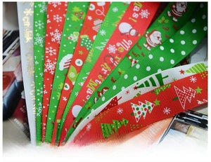 Detail of Christmas ribbons with festive patterns like snowflakes and Merry Christmas text