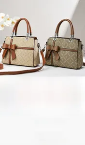 Detail shot of vintage monogram handbags with 3D bow decoration and heart charms
