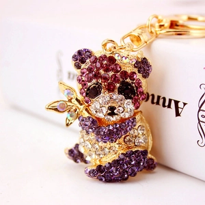 Sparkling panda keychain with purple and clear rhinestones on a gold metal ring