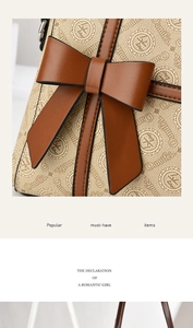 Detail of a large brown bow and monogram print on a stylish women's shoulder handbag