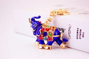Detailed view of colorful rhinestones and royal blue enamel on elephant keychain