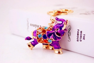 Close-up of purple enamel elephant keychain with colorful rhinestones and gold metal hook