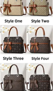 Detail view of four large capacity tote bags with floral prints and bow heart charms