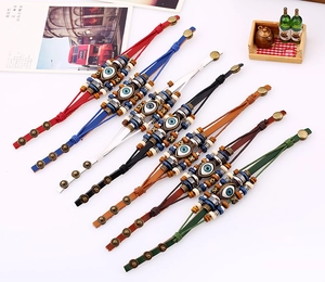 Close-up of beaded evil eye multilayer leather bracelets with adjustable metal snap buttons