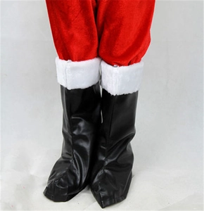 Detail of black Santa boots with white faux fur trim and red velvet trousers