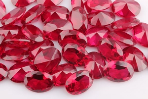 Macro view of red oval faceted AAA cubic zirconia stones for minimalist stud earrings