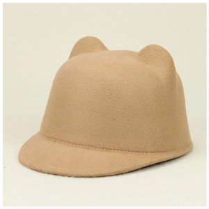 Close-up of camel felt equestrian hat with cute cat ears and fine wool texture