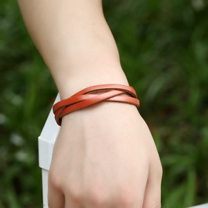 Handmade woven multilayer orange leather wrap bracelet for men and women worn outdoors