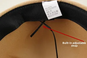 Detail of wool felt hat interior with internal adjustment strap and 57cm size label