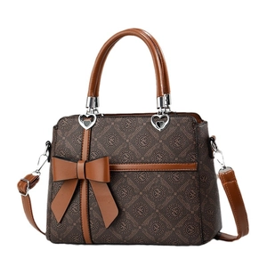 Retro brown monogram handbag for women with bow detail and heart charm shoulder strap