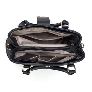 Detailed overhead view of the interior compartments and lining of the black leather tote bag
